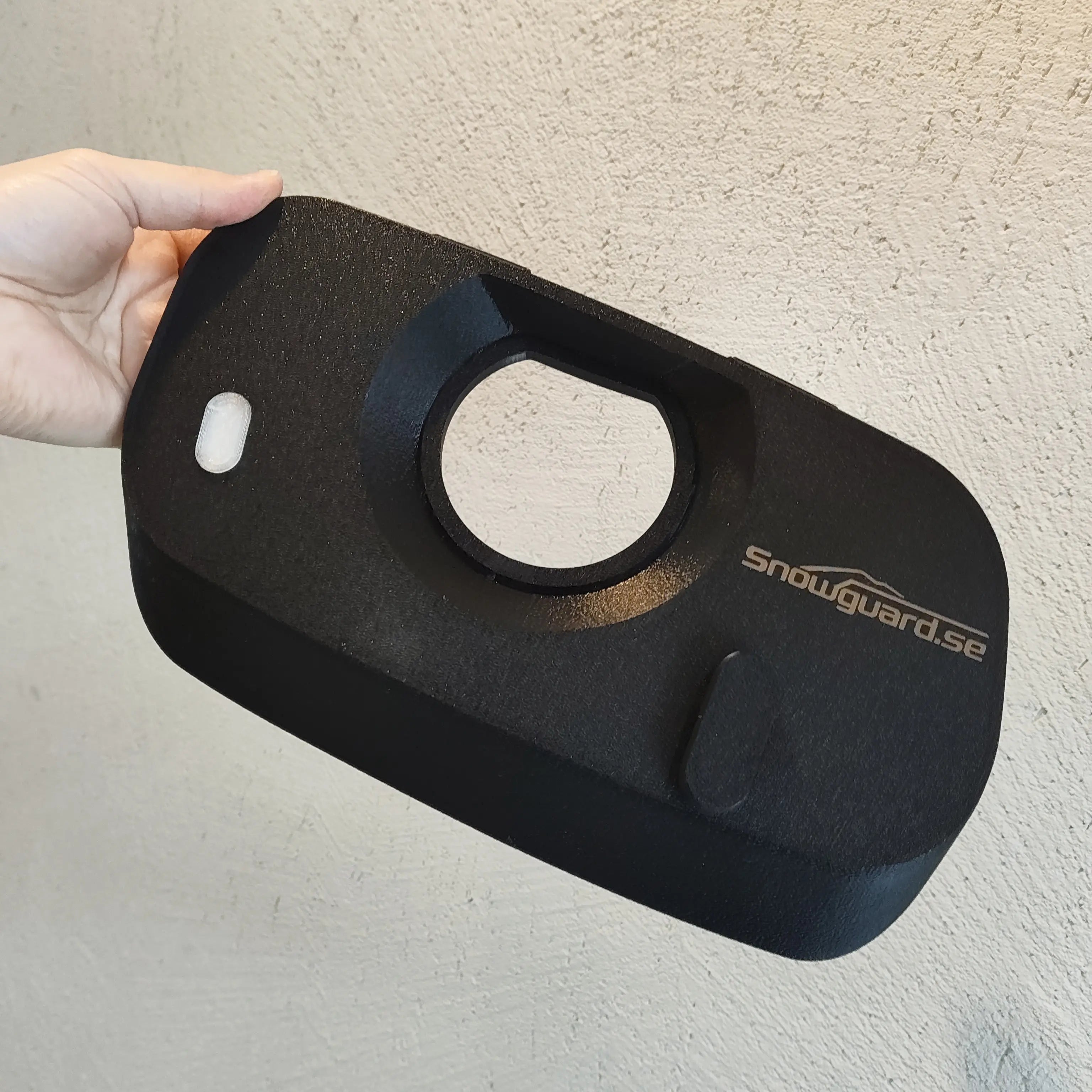 Snowguard latausportin suoja
